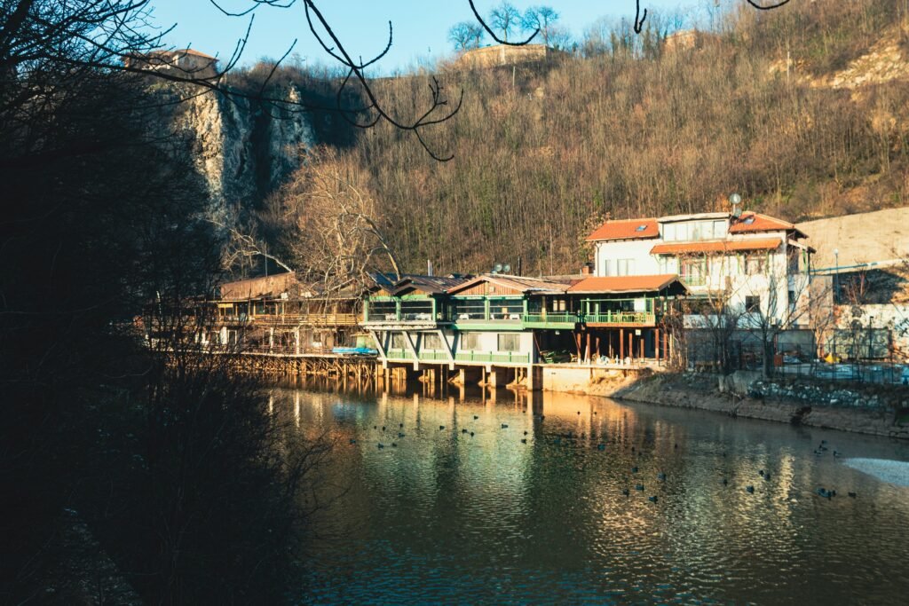 a body of water with a building on the side of it